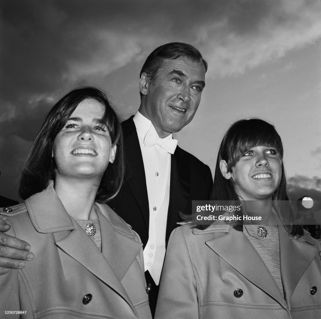 American actor James Stewart with his twin daughters Judy and Kelly
