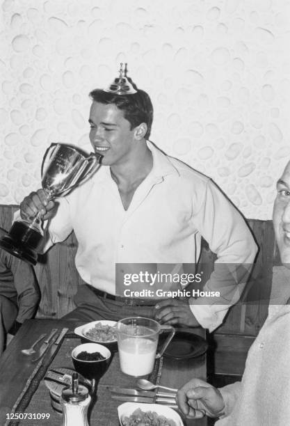 Austrian-American bodybuilder and actor Arnold Schwarzenegger with his Mr Universe trophy after winning the contest in London, UK, September 1967.