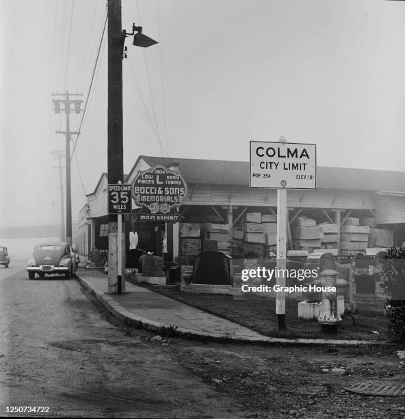 Bocci and Sons Memorials, an emporium selling stone funeral monuments at the Colma city limits in California, circa 1955.