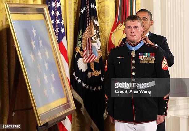 President Barack Obama presents former active duty Marine Corps Corporal Dakota Meyer with the Medal of Honor during an East Room ceremony September...