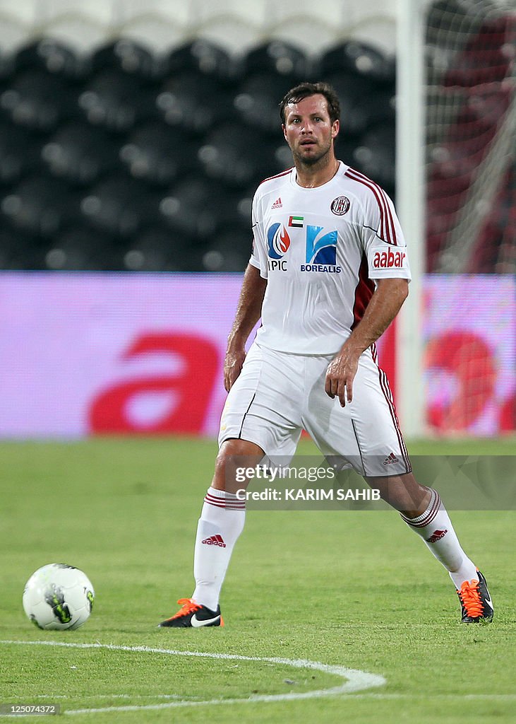 Lucas Neill of Al-Jazira club controls t