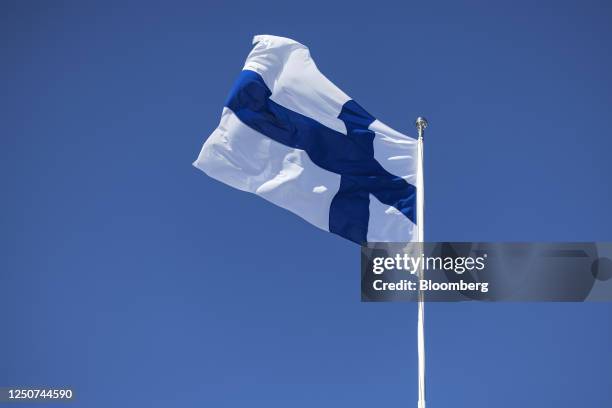 The national flag of Finland on the roof of Helsinki City Hall in Helsinki, Finland, on Monday, April 3, 2023. A pro-business opposition group...