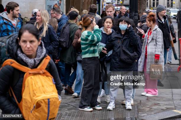 Young person wearing a face mask to protect against Coronavirus / Covid-19 on 26th March 2023 in London, United Kingdom. The usage of face coverings...