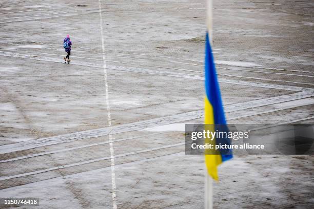 April 2023, Ukraine, Slawutytsch: A child walks across the central square in the small town of Slavutych. Slavutych was built in the late 1980s after...