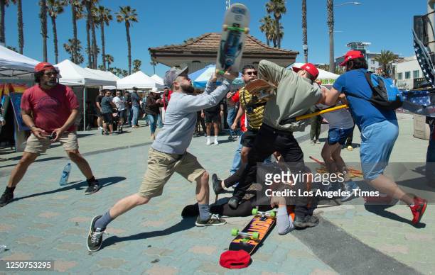 Huntington Beach, CA Skateboarders clash with a group of demonstrators gathered in support of recently indicted former president Donald Trump on...