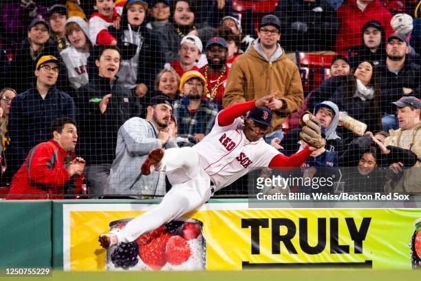 Rafael Devers of the Boston Red Sox catches a foul ball during the eighth inning of a game against the Pittsburgh Pirates on April 3, 2023 at Fenway...