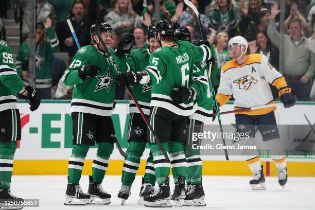 Fredrik Olofsson 5 and Colin Miller of the Dallas Stars celebrate a goal against the Nashville Predators at the American Airlines Center on April 3,...