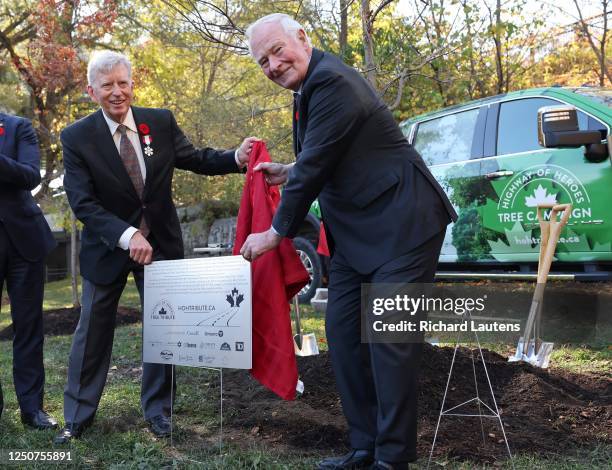 November 2: Mark Cullen who spearheaded the initiative unveils a plaque at the site of the final tree with the former Governor General David Johnston...