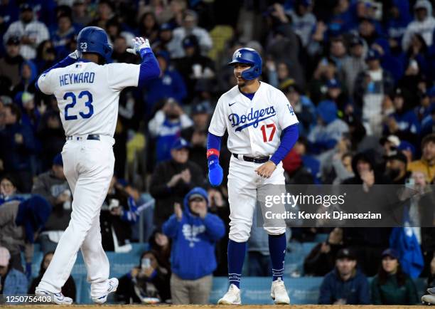Jason Heyward of the Los Angeles Dodgers celebrates after hitting a two-run homer run with Miguel Vargas against relief pitcher Jake Bird of the...