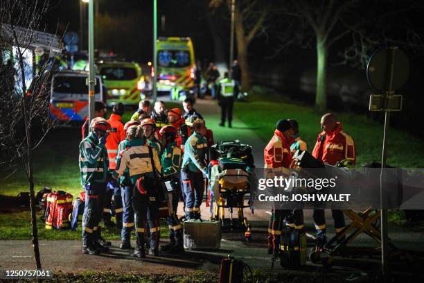 Emergency services work at the site of a derailed train in Voorschoten, on April 4, 2023. The passenger train collided with construction equipment on...