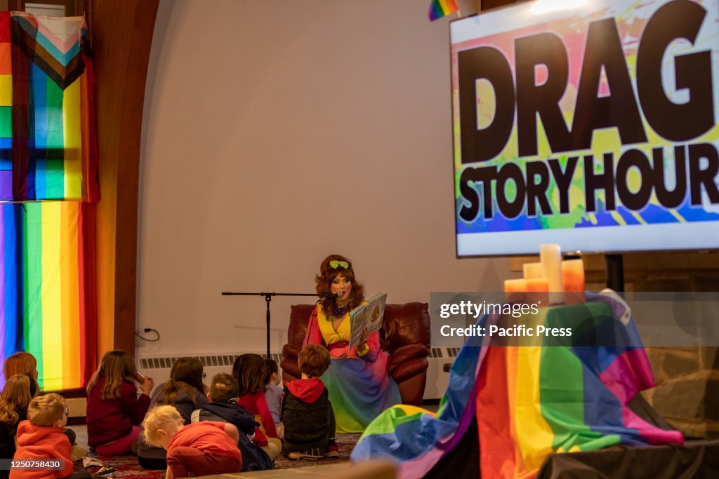A Drag performer reads a children's book at The Community...