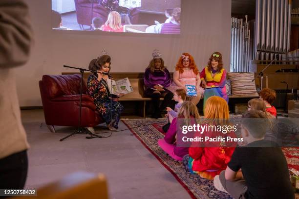 Drag performer reads from a children's book at The Community Church of Chesterland's Drag Queen Story Hour in Chesterland, Ohio. The heightened...