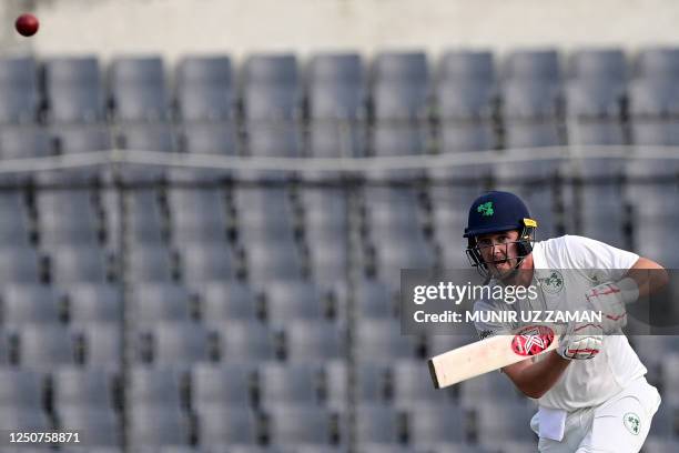 Ireland's Mark Adair plays a shot during the first day of the Test cricket match between Bangladesh and Ireland at the Sher-e-Bangla National Cricket...