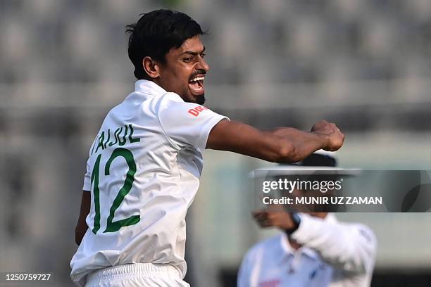 Bangladesh's Taijul Islam celebrates after taking the wicket of Ireland's Mark Adair during the first day of the Test cricket match between...