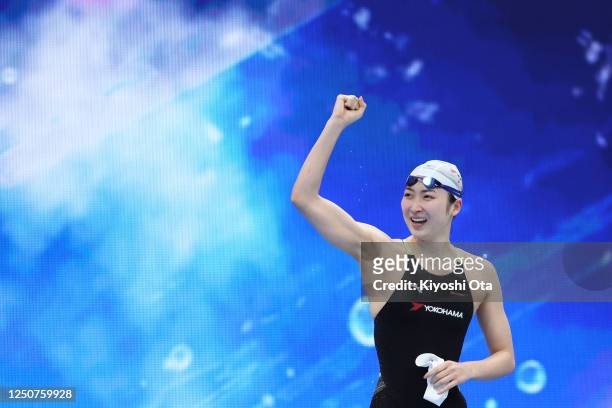 Rikako Ikee reacts after winning the Women's 100m Butterfly Final during day one of the Japan Swim at Tokyo Aquatics Centre on April 4, 2023 in...