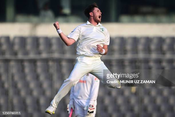 Ireland's Mark Adair celebrates after taking the wicket of Bangladesh's Najmul Hossain Shanto during the first day of the Test cricket match between...