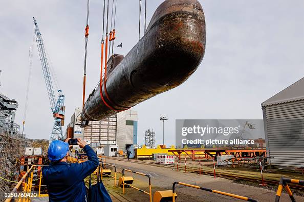 The submarine U17 is being transported to the dry dock at the Thyssen ...