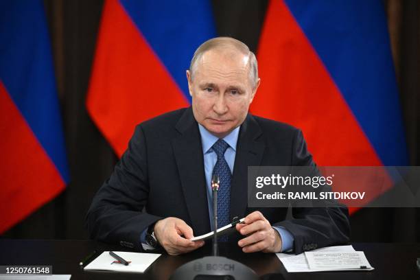 Russian President Vladimir Putin chairs a meeting with the State Council Presidium on developing Russian industry under sanctions pressure during his...