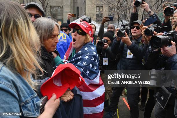 Pro and anti trump supporters face off during a protest outside of Manhattan Criminal Court in New York City on April 4, 2023. - Donald Trump will...