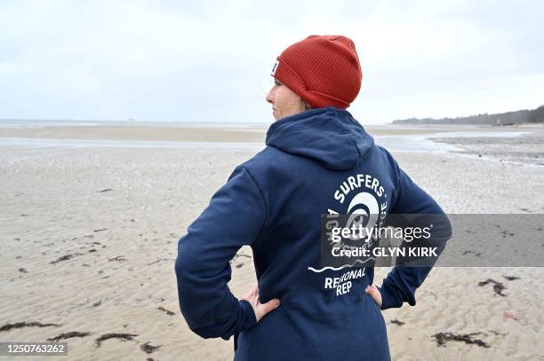 Surfers Against Sewage representative Chani Kind looks at the sea on March 30 from Ryde beach, on the Isle of Wight, which has suffered from sewage...