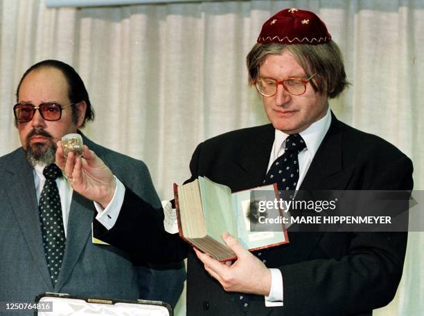 The Rabbi of Sao Paulo Henry Sobel displays the journal of ex-Nazi Albert Blume as well as a jar containing gold tooth fillings 26 November after...