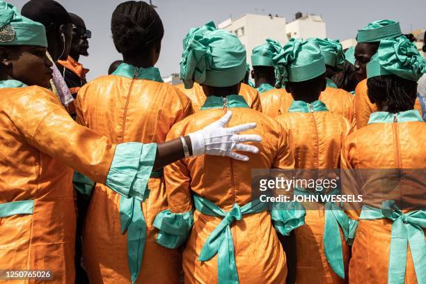 School girls gets ready to take part in celebrations for Senegals 63rd Independence Day in Dakar on April 04, 2023.