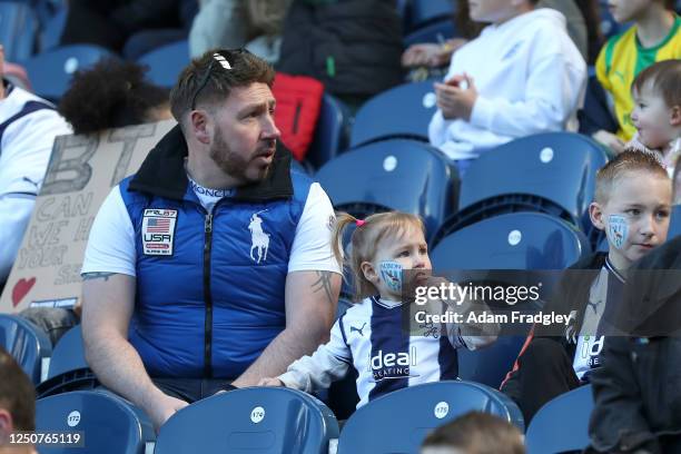 Fans watch on during an open training session at The Hawthorns on April 4, 2023 in West Bromwich, England.