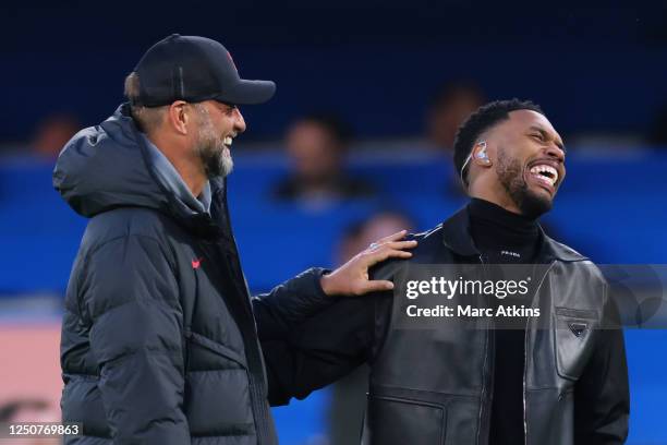 Jurgen Klopp manager of Liverpool with former Liverpool player Daniel Sturridge during the Premier League match between Chelsea FC and Liverpool FC...