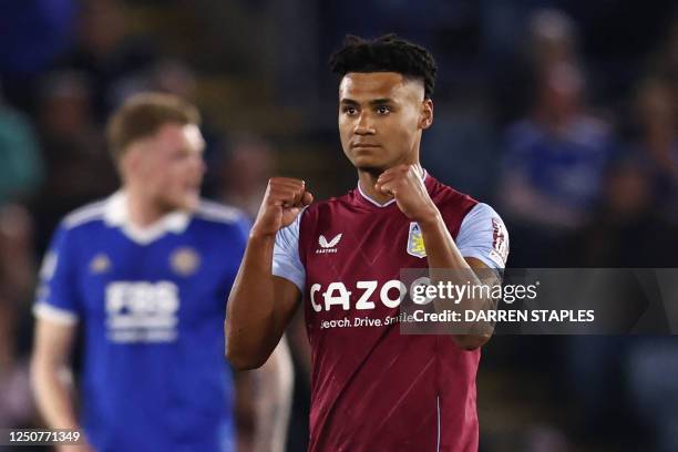 Aston Villa's English striker Ollie Watkins celebrates after scoring the opening goal of the English Premier League football match between Leicester...