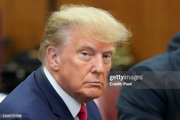 Former U.S. President Donald Trump appears in the courtroom for his arraignment proceeding at Manhattan Criminal Court on April 4 in New York City....