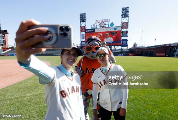 Hannah Green of Australia and Minjee Lee of Australia pose for a photo with San Francisco Giants mascot Lou Seal ahead of the Hanwha LIFEPLUS...