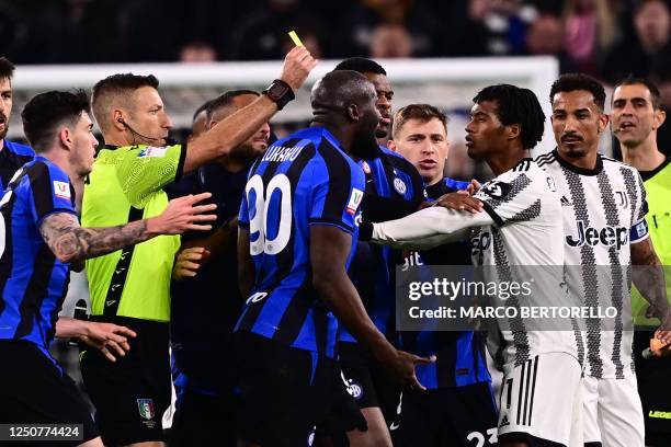 Inter Milan's forward Romelu Lukaku argues with Juventus' midfielder Juan Cuadrado from Colombia during the Italian Cup semi-final first leg football...