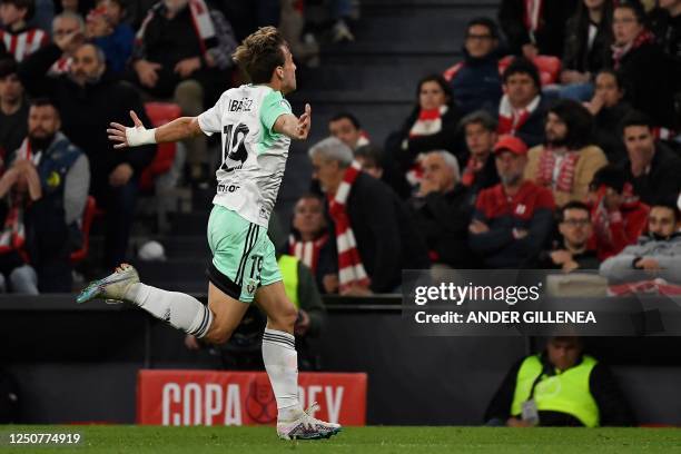 Osasuna's Spanish midfielder Pablo Ibanez celebrates after scoring his team's first goal during the Spanish Copa del Rey semi final second leg...