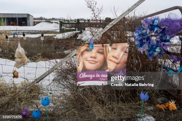 Picture of Tylee Ryan and J.J. Vallow is seen on a fence opposite the property where their bodies were found in 2020, on April 4, 2023 in Rexburg,...