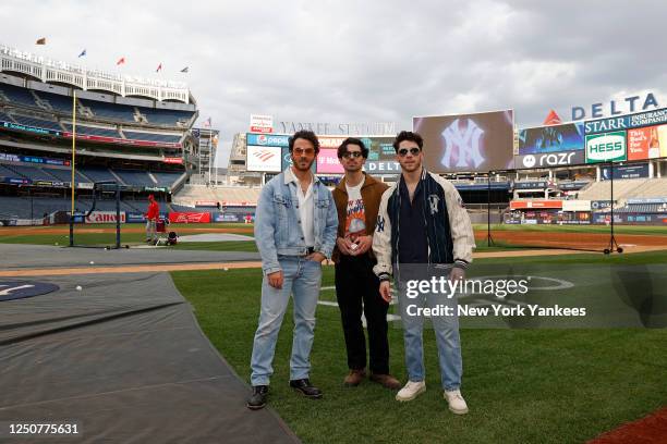 The Jonas Brothers attend the game between the Philadelphia Phillies and the New York Yankees at Yankee Stadium on April 4, 2023 in New York, New...