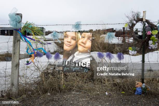 Picture of Tylee Ryan and J.J. Vallow is seen on a fence opposite the property where their bodies were found in 2020, on April 4, 2023 in Rexburg,...