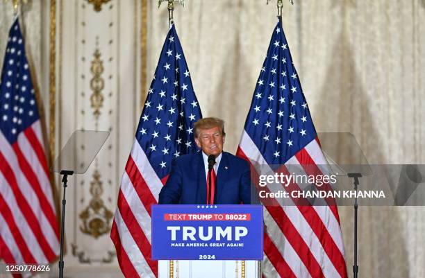 Former US president Donald Trump speaks during a press conference following his court appearance over an alleged 'hush-money' payment, at his...