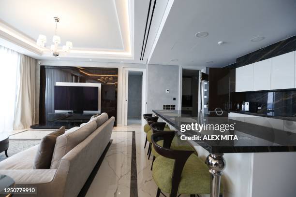 This picture taken on March 20, 2023 shows the living room of a 320 square meter whole floor apartment on sale for 5 million Euro in Limassol. - In...