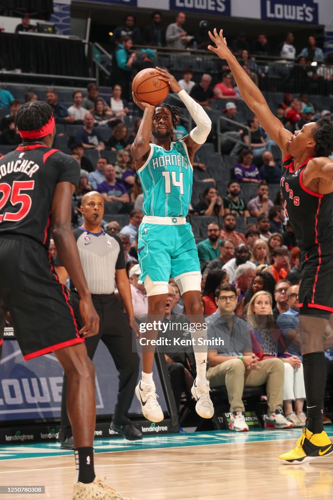 Kobi Simmons of the Charlotte Hornets shoots a three point basket ...