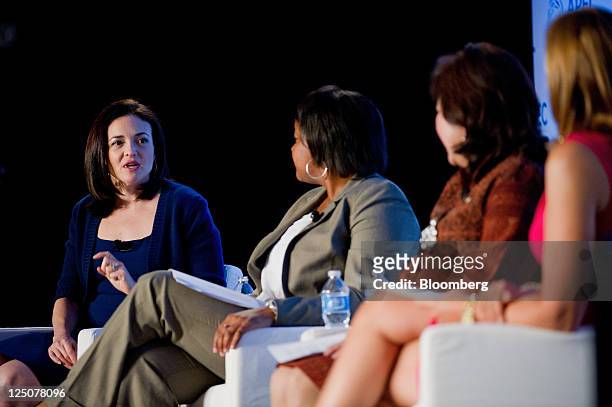 Sheryl Sandberg, chief operating officer of Facebook Inc., from left, speaks as Danielle Gray, deputy director of the National Economic Council, Mari...