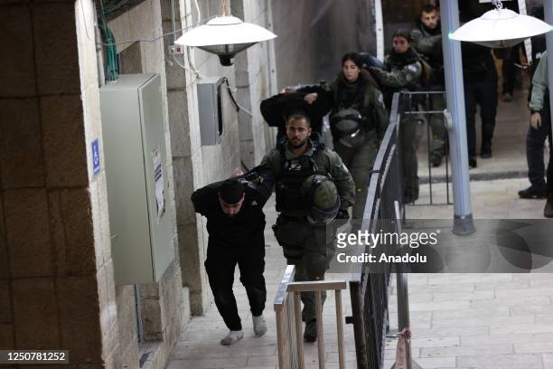 Israeli police detained some Palestinians after Israeli police again raided the Al-Aqsa Mosque complex in East Jerusalem early Sunday in Jerusalem on...