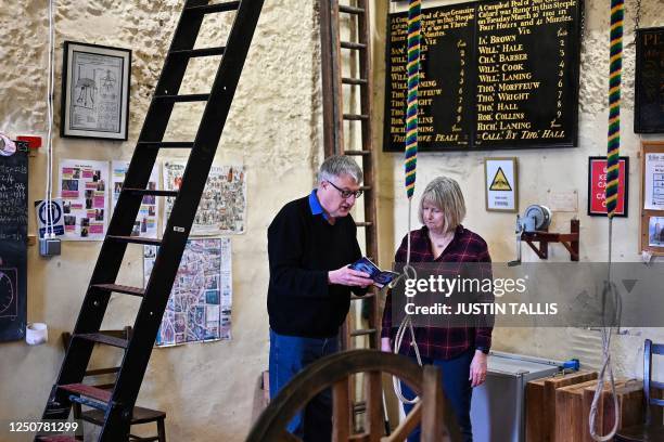 Tower Captain Paul Flavell teaches Charlotte Mafi during a bell ringing training session at All Saints Church, in Kingston-upon-Thames, in southwest...