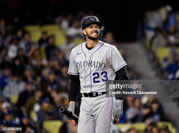 Kris Bryant of the Colorado Rockies reacts after getting called out on strike with bases loaded against starting pitcher Julio Urias of the Los...