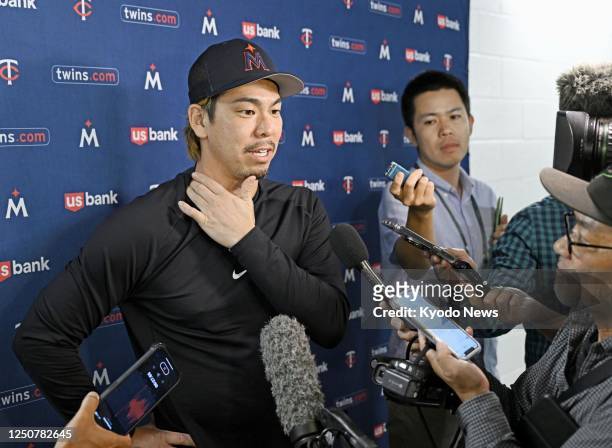 Kenta Maeda meets the press after making his first pitching start in one year and eight months for the Minnesota Twins in a baseball game against the...