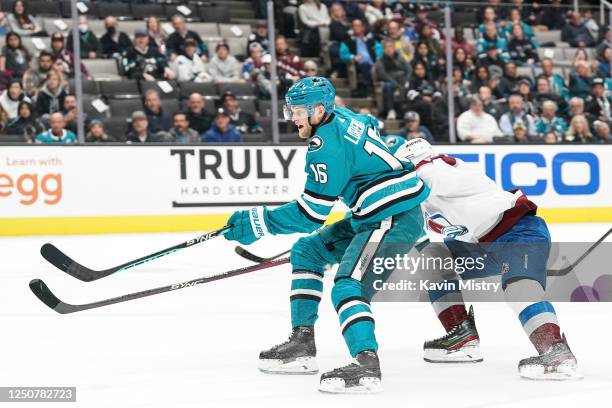 Steven Lorentz of the San Jose Sharks skates with the puck in the first period against Jack Johnson of the Colorado Avalanche at SAP Center on April...