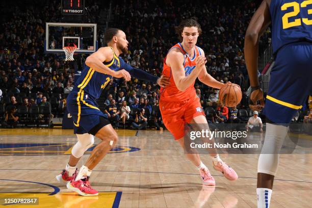 Josh Giddey of the Oklahoma City Thunder moves the ball during the game against the Golden State Warriors on April 4, 2023 at Chase Center in San...