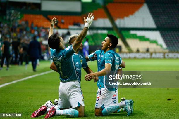 Victor Davila of Leon celebrates after scoring the team's third goal with teammate Angel Mena during the quarterfinals first leg match between Leon...
