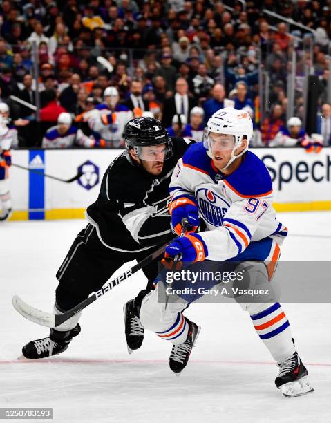 Matt Roy of the Los Angeles Kings and Connor McDavid of the Edmonton Oilers battle for position during the second period at Crypto.com Arena on April...