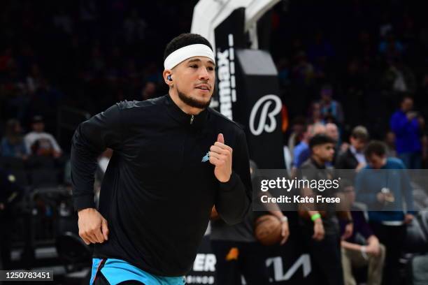 Devin Booker of the Phoenix Suns warms up before the game against the San Antonio Spurs on April 4, 2023 at Footprint Center in Phoenix, Arizona....