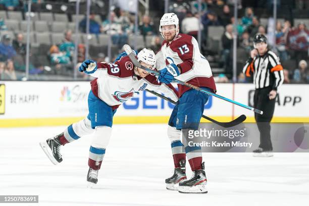 Nathan MacKinnon and Valeri Nichushkin of the Colorado Avalanche celebrate scoring the game-winning goal in overtime against the San Jose Sharks at...